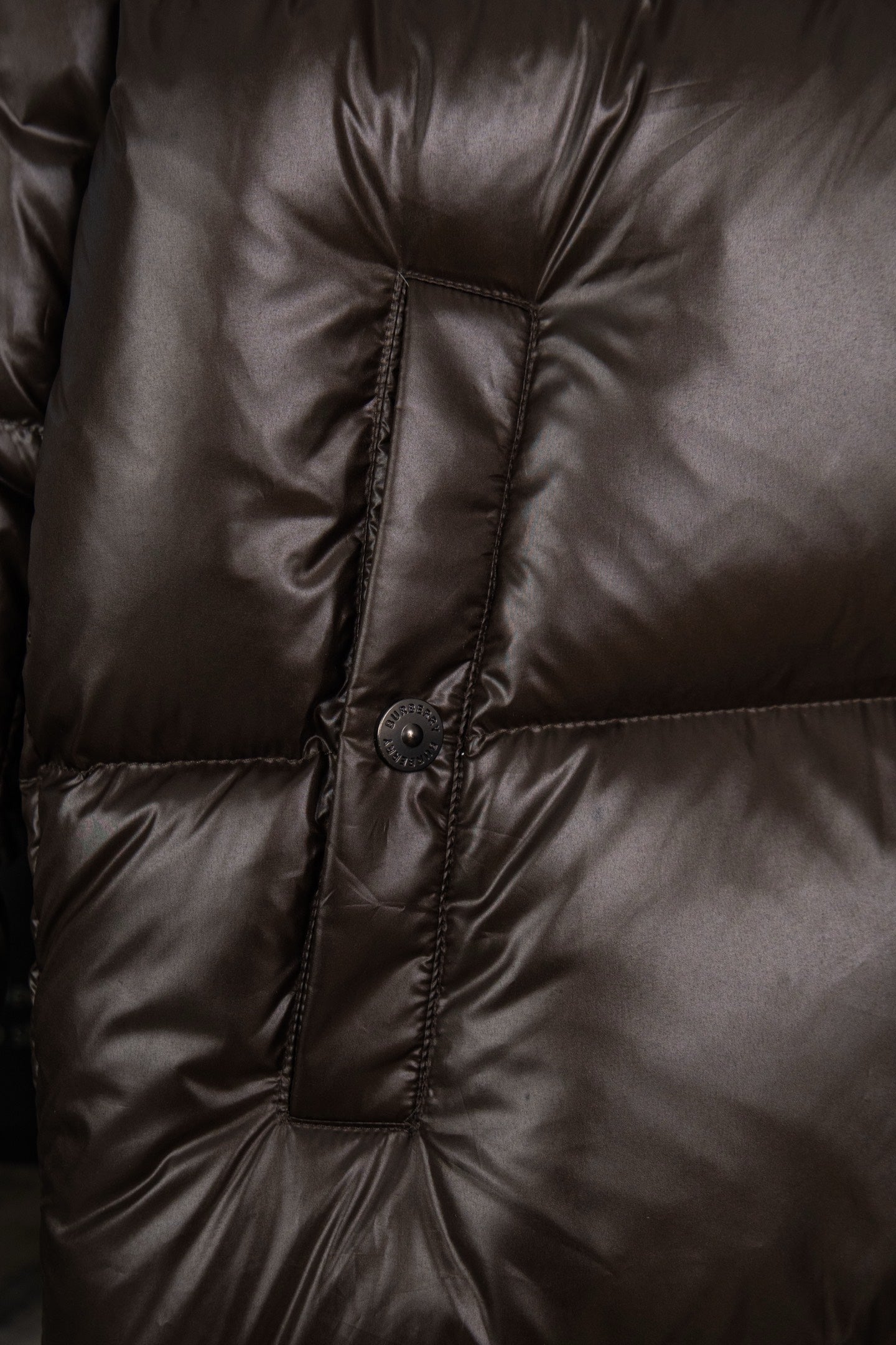Long puffer jacket with central stitched panel and snap button placket