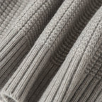 Light gray cable knit texture with raised ribbed pattern