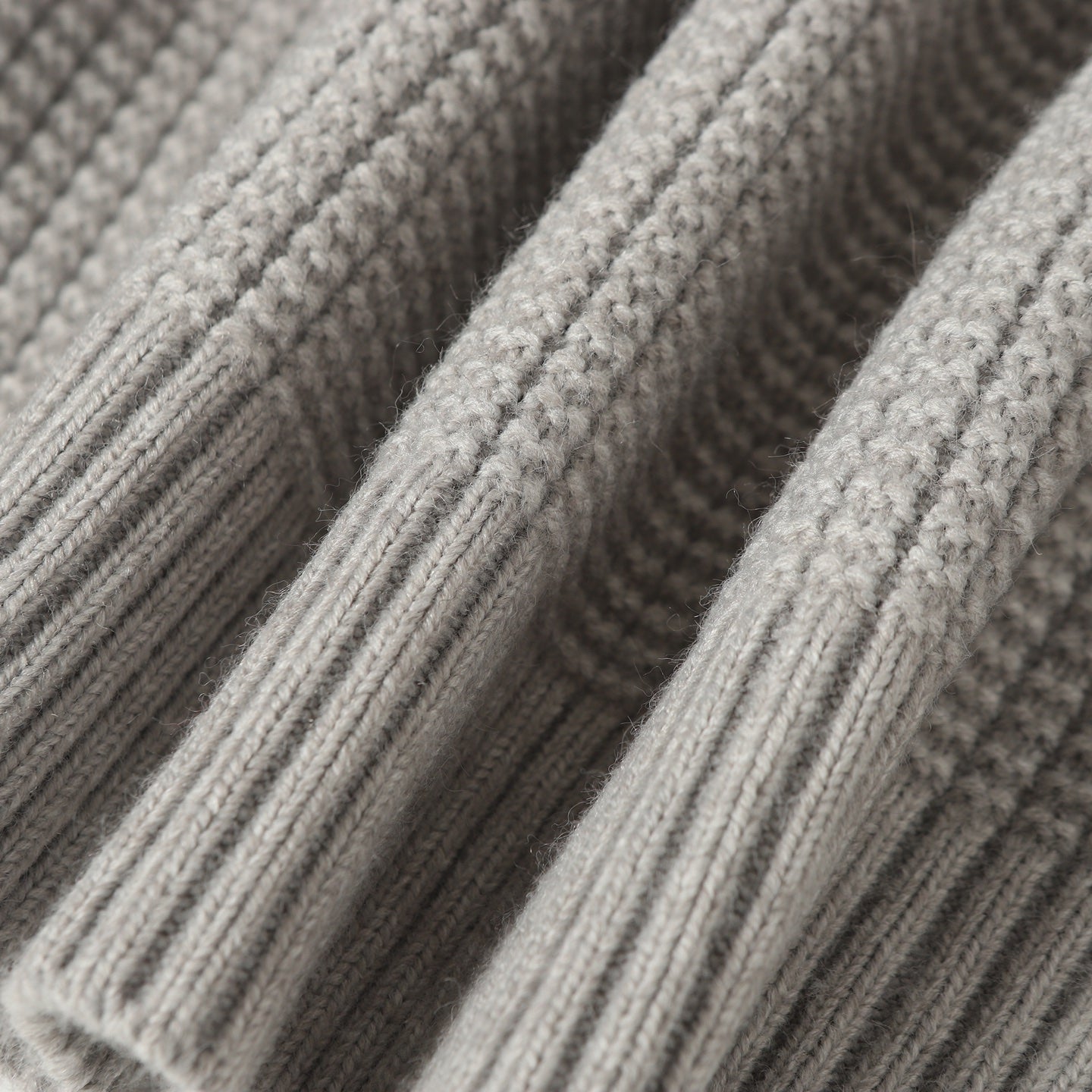 Light gray cable knit texture with raised ribbed pattern