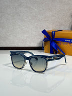 Louis Vuitton sunglasses, blue-tinted lenses with silver frame and gold details