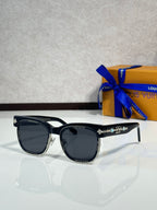 Louis Vuitton sunglasses, black frame with dark lenses and gold-tone decorative bar