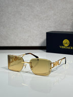 Versace sunglasses with gold frame and amber gradient lenses, front angle