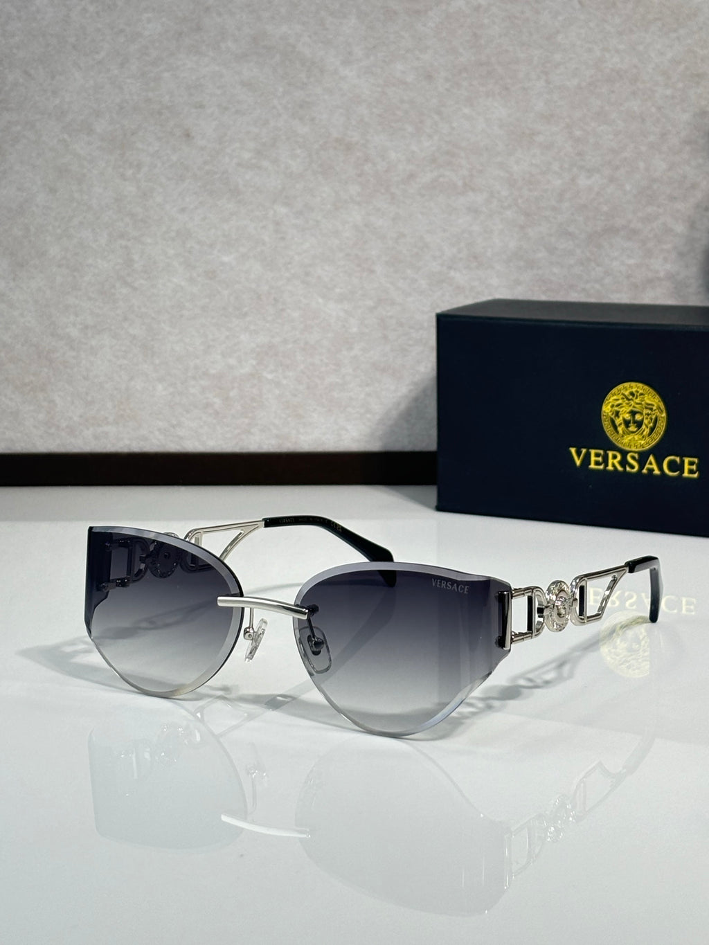 Versace round aviator sunglasses with dark gradient lenses and logo detail metal temples