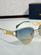 Versace gold metal aviator sunglasses with blue tint lenses and ornate logo temple detail