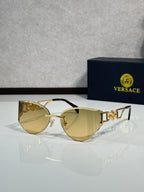 Versace gold metal aviator sunglasses with pale yellow tinted lenses and logo detail temples