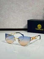 Versace gold metal aviator sunglasses with gradient tinted lenses and logo detail temples