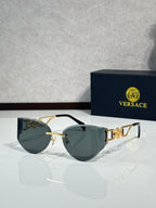 Versace gold metal aviator sunglasses with tinted dark lenses and logo detail temples