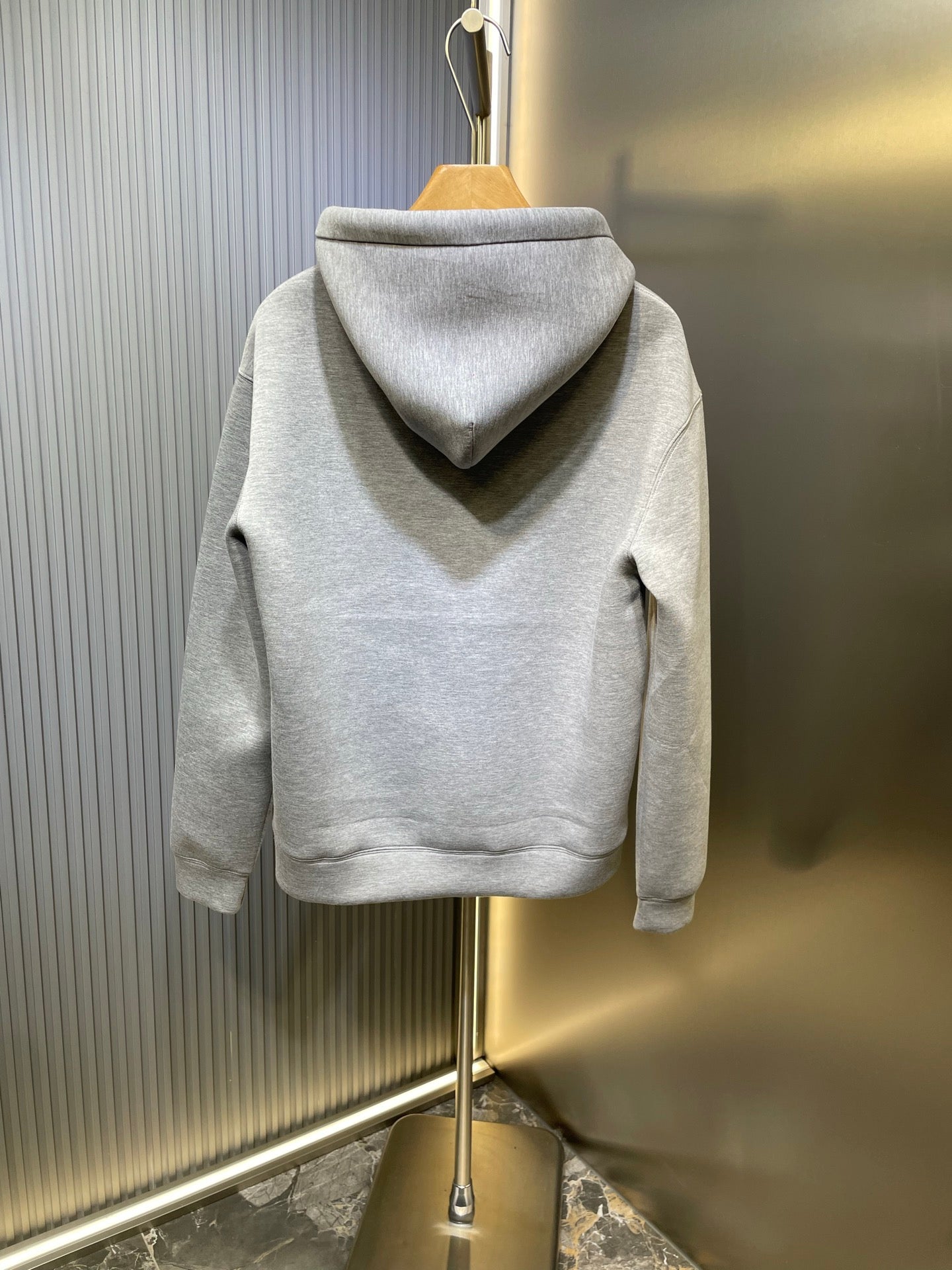 Light gray Gucci hoodie with hood and drawstrings, back view