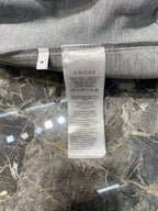 Light gray Gucci hoodie size and care label inside neckline
