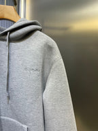 Light gray Gucci hoodie sleeve with small side logo embroidery
