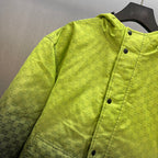 Lime green hooded jacket detail: GG pattern, snap buttons, and stitched seams