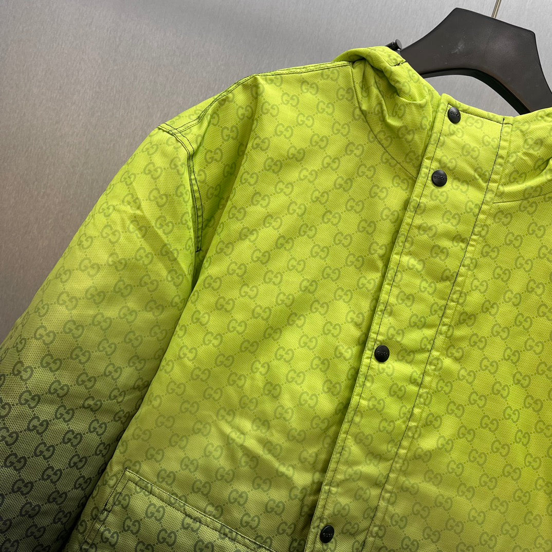 Lime green hooded jacket detail: GG pattern, snap buttons, and stitched seams