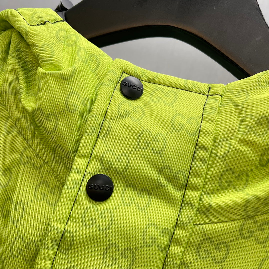 Lime green jacket collar with two snap buttons and GG monogram texture