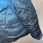 Gucci hooded puffer jacket, blue GG logo pattern, sleeve cuff pocket detail