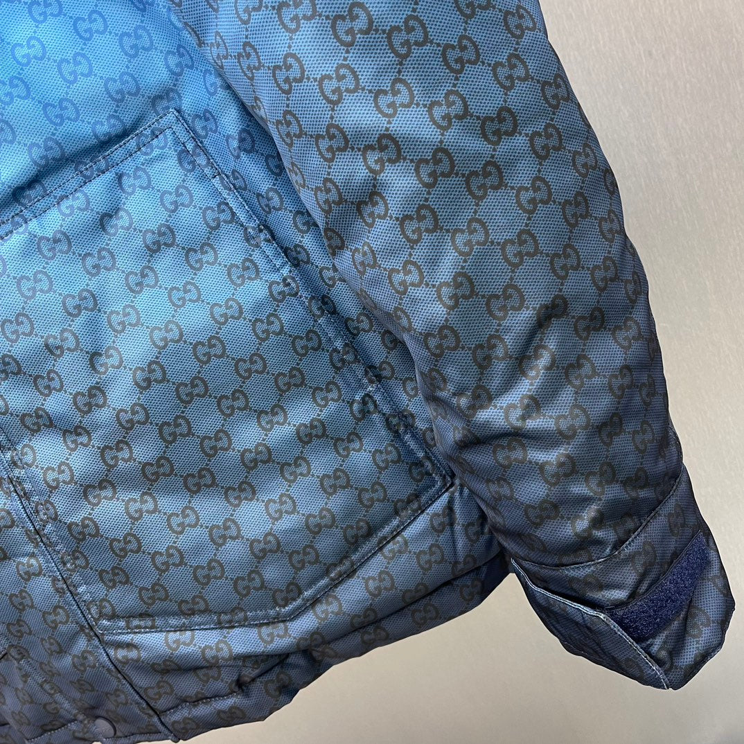 Gucci hooded puffer jacket, blue GG logo pattern, sleeve cuff pocket detail