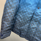 Gucci hooded puffer jacket, blue GG logo pattern, side seam pocket detail