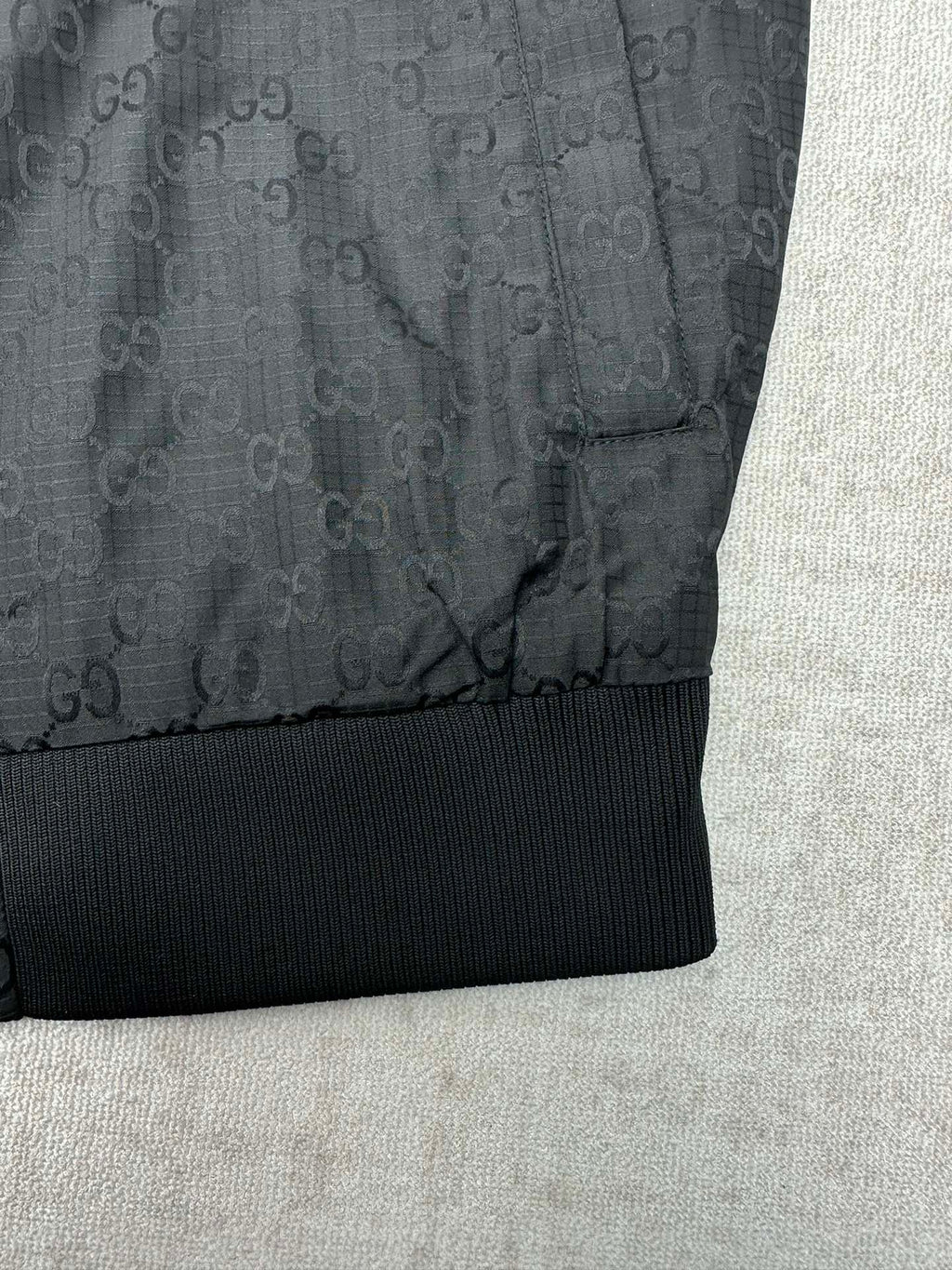 Gucci dark GG-pattern jacket with ribbed waistband and hem