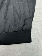 Gucci dark GG-pattern jacket with ribbed waistband and hem