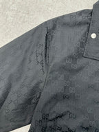 Gucci dark GG-pattern jacket with snap shoulder button and zip placket