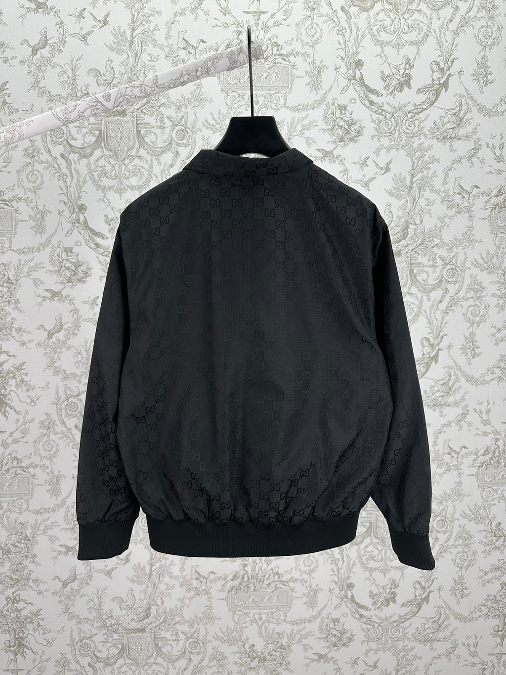 Gucci dark GG-pattern bomber jacket with ribbed hem and stand collar