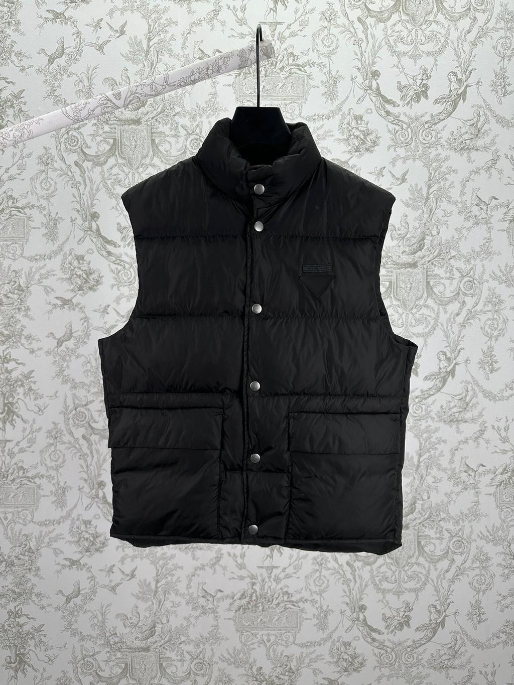 Prada sleeveless black puffer vest with button front and stand collar