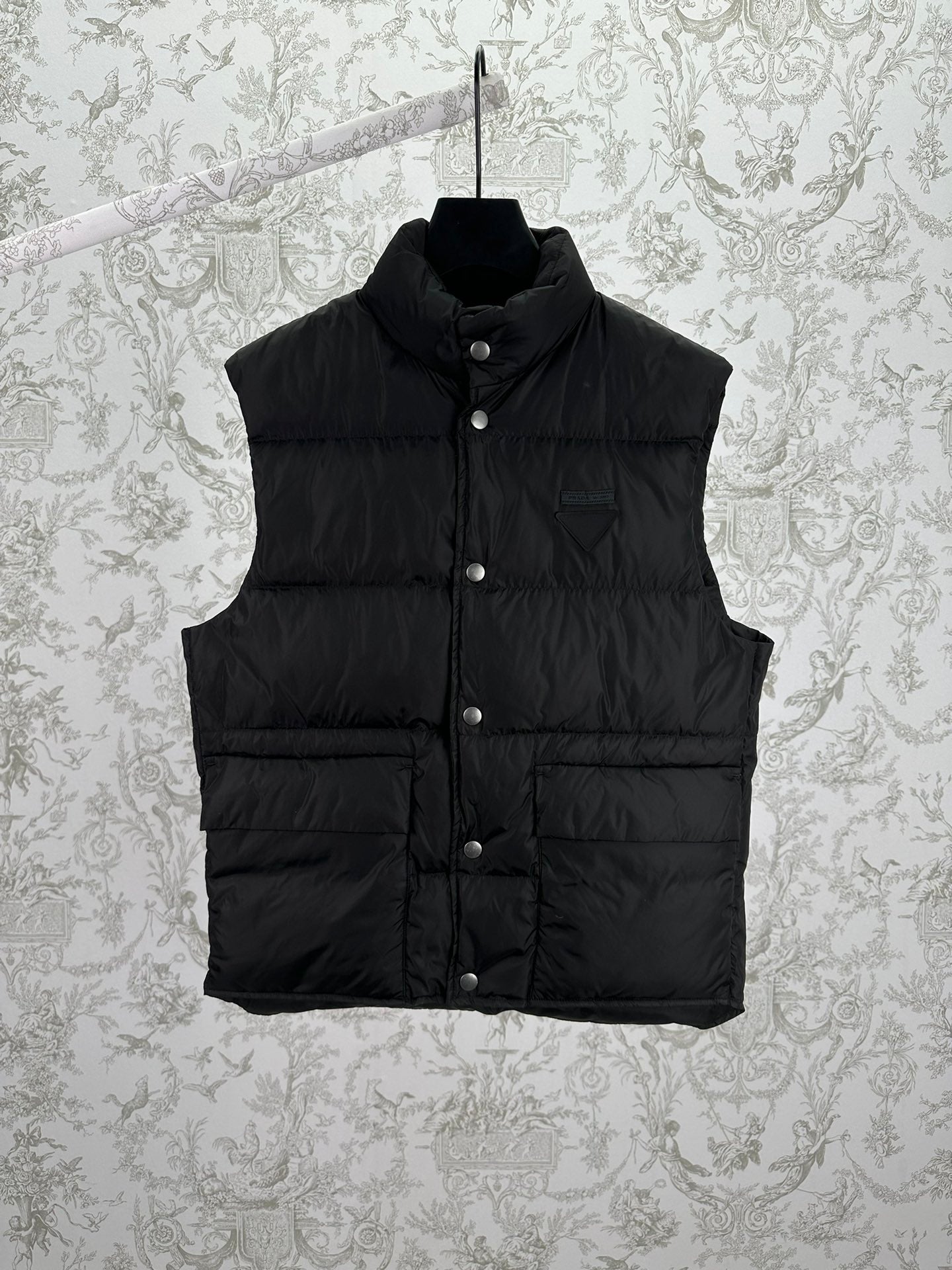 Prada sleeveless black puffer vest with button front and stand collar