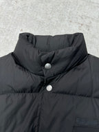 Black sleeveless puffer vest collar with snap buttons