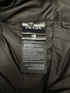 Prada inner label with size text and NFC tag on dark fabric