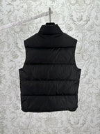 Back view of black sleeveless puffer vest with horizontal quilting