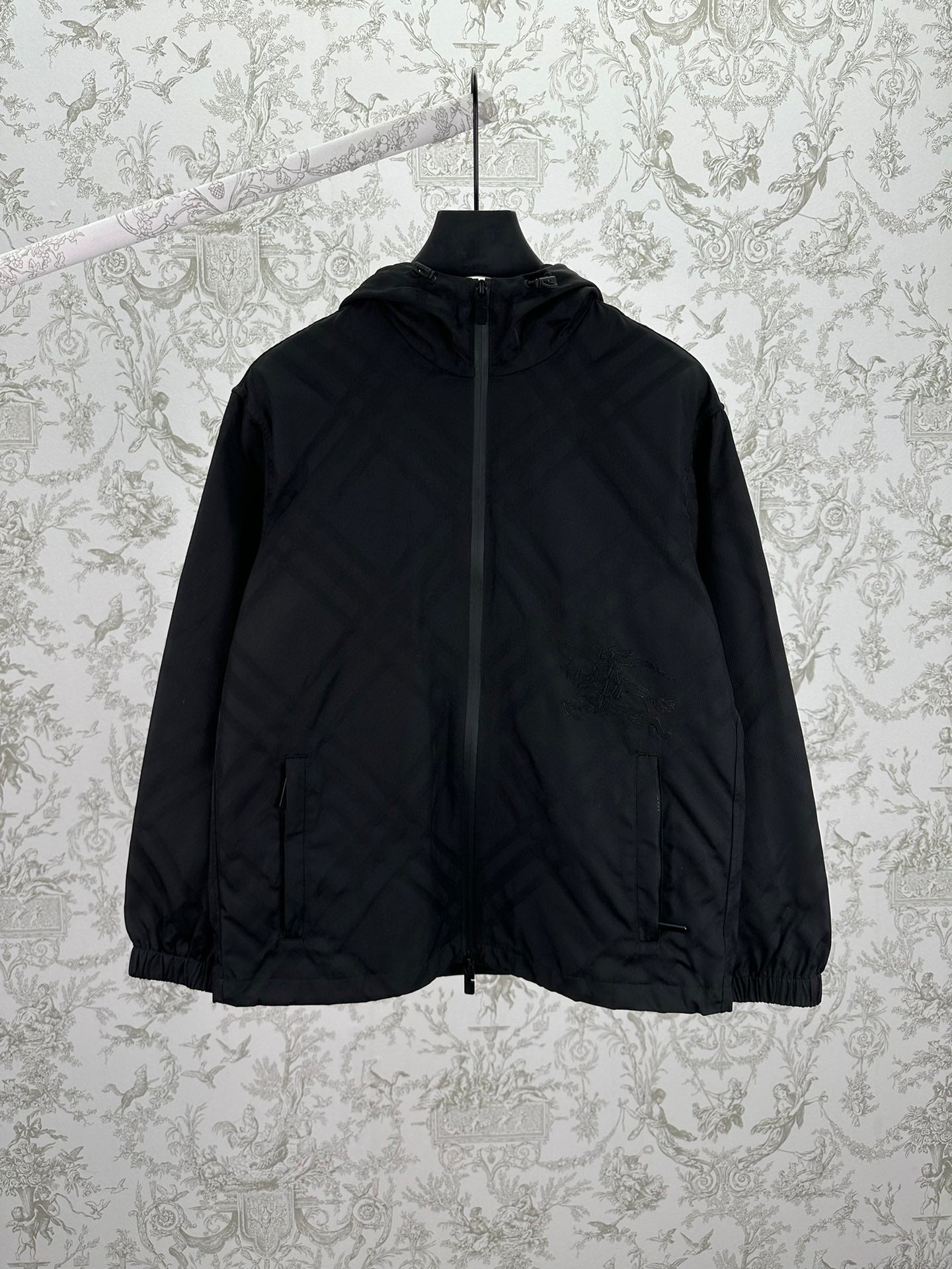 Hooded puffer jacket with front zipper, dark color, long sleeves