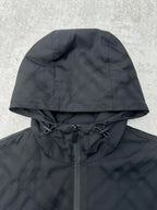 Hood detail with drawstring ties and front zipper, dark puffer jacket