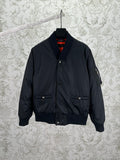 Navy bomber jacket with snap front, standing collar, and two chest pockets