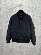 Navy bomber jacket with snap front, standing collar, and two chest pockets