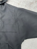 Close-up of dark jacket fabric with stitched panel lines
