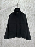 Black hooded jacket with front zipper and two flap pockets