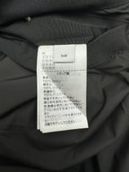 Size and care label on dark hooded jacket