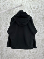 Black hooded jacket back view with attached hood and seam details