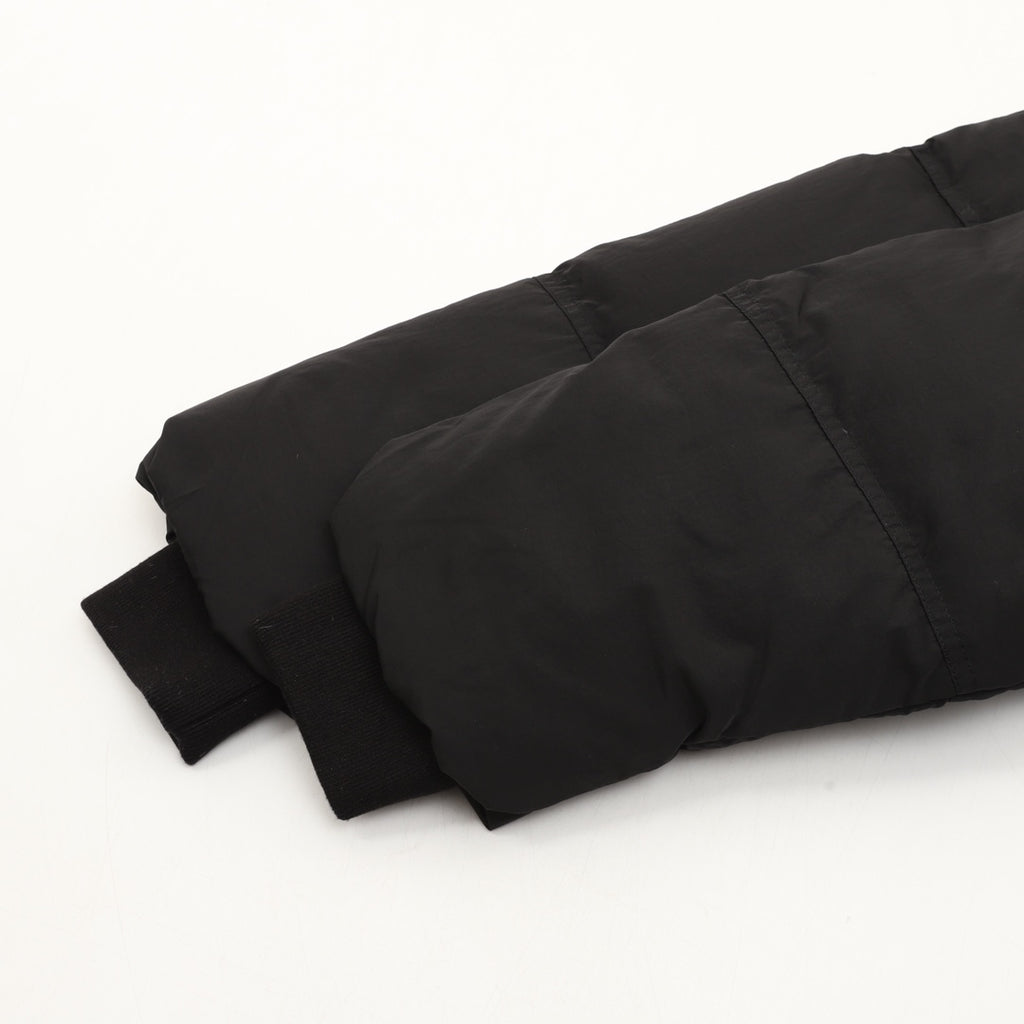 Black puffer jacket hem and padded sleeves with ribbed cuffs