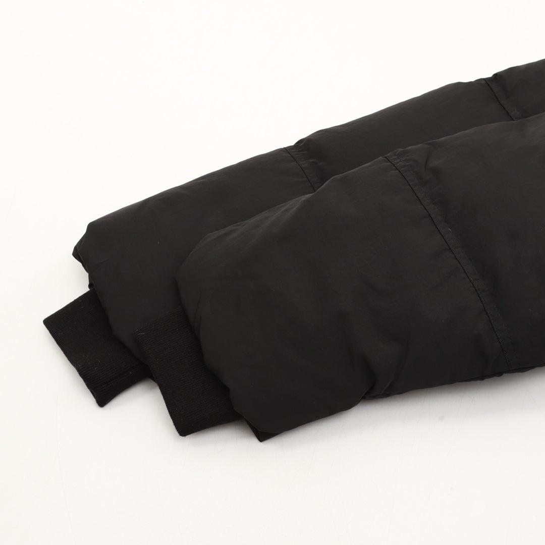 Black puffer jacket hem and padded sleeves with ribbed cuffs