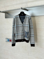 Long-sleeve button-front knit cardigan with black-and-white check pattern and ribbed hem