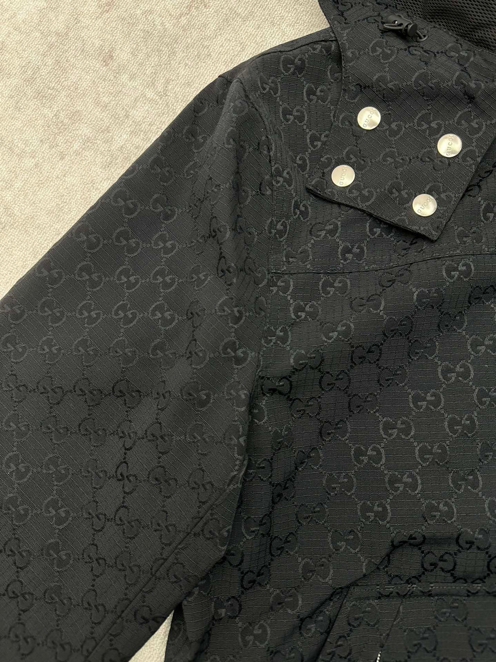 Gucci long jacket shoulder and collar, dark GG pattern with snap button tabs