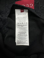 Gucci long jacket fabric label inside neck, black text on white care tag