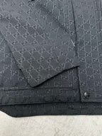 Gucci long jacket chest detail, dark GG pattern with flap pocket and snap strap