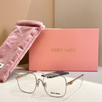 Gold and silver eyeglass frames with blue temple accents and clear lenses
