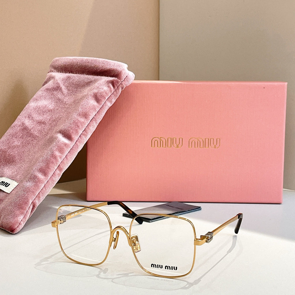 Gold metal eyeglass frames with blue temple accents and clear lenses