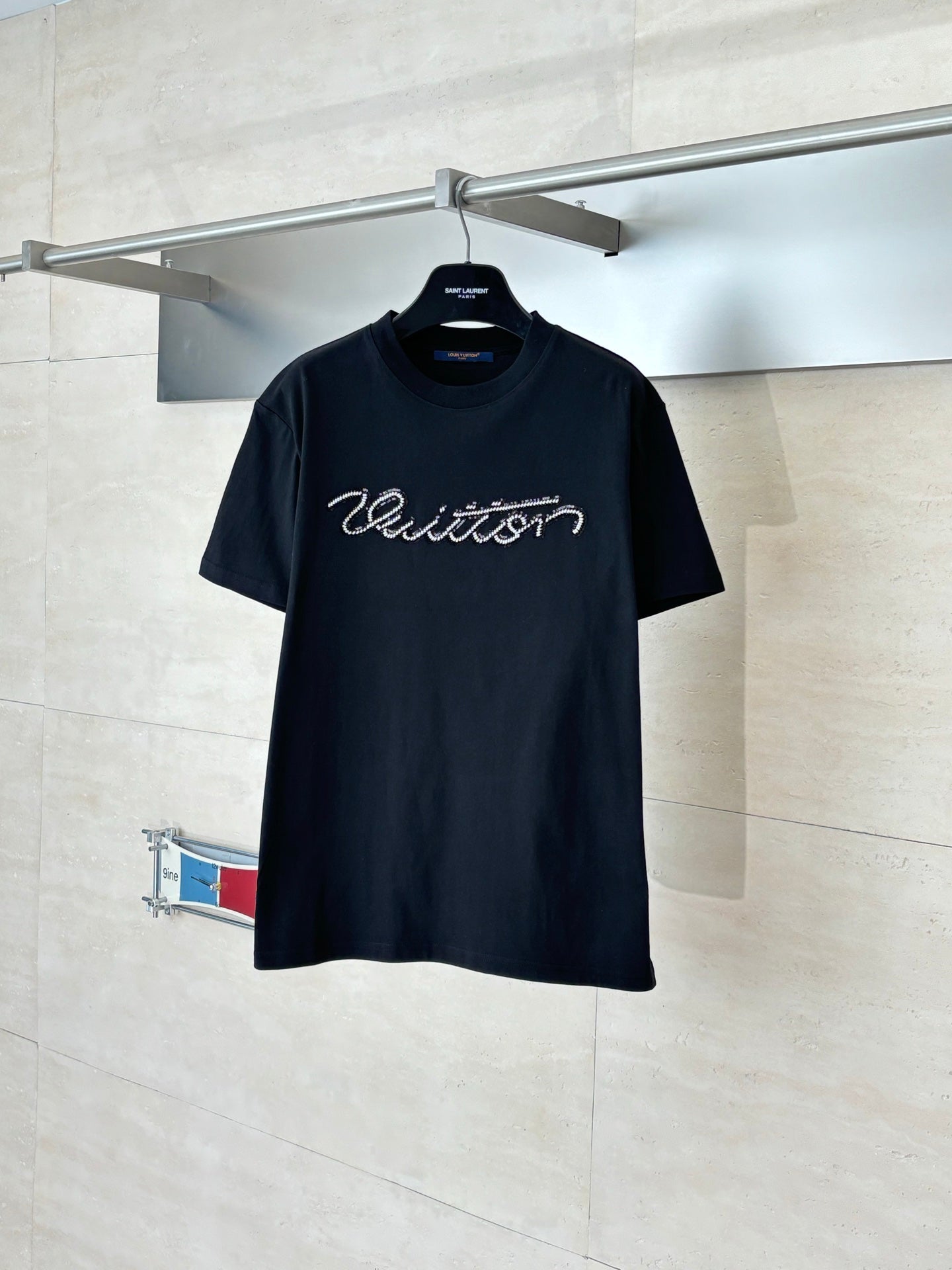 Louis Vuitton T-shirt, black crew neck with script logo on the front.