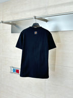 Louis Vuitton T-shirt, black crew neck with small back patch near the collar.
