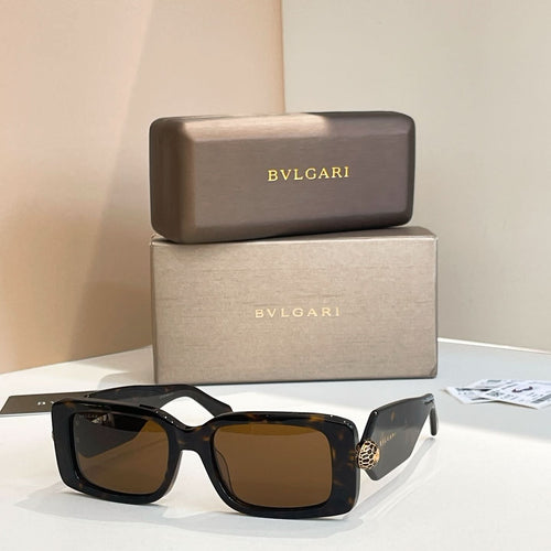 Black square sunglasses with brown lenses and gold logo temple detail