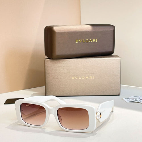 White square sunglasses with tinted pink lenses and gold logo temple detail
