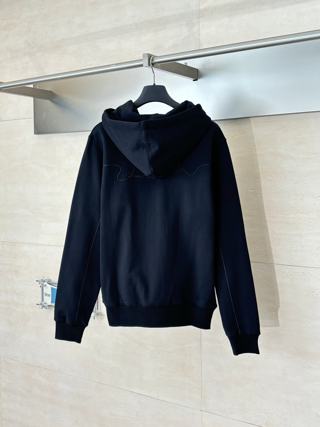 Dior long-sleeve hoodie in dark navy, back view with hood and drawstrings